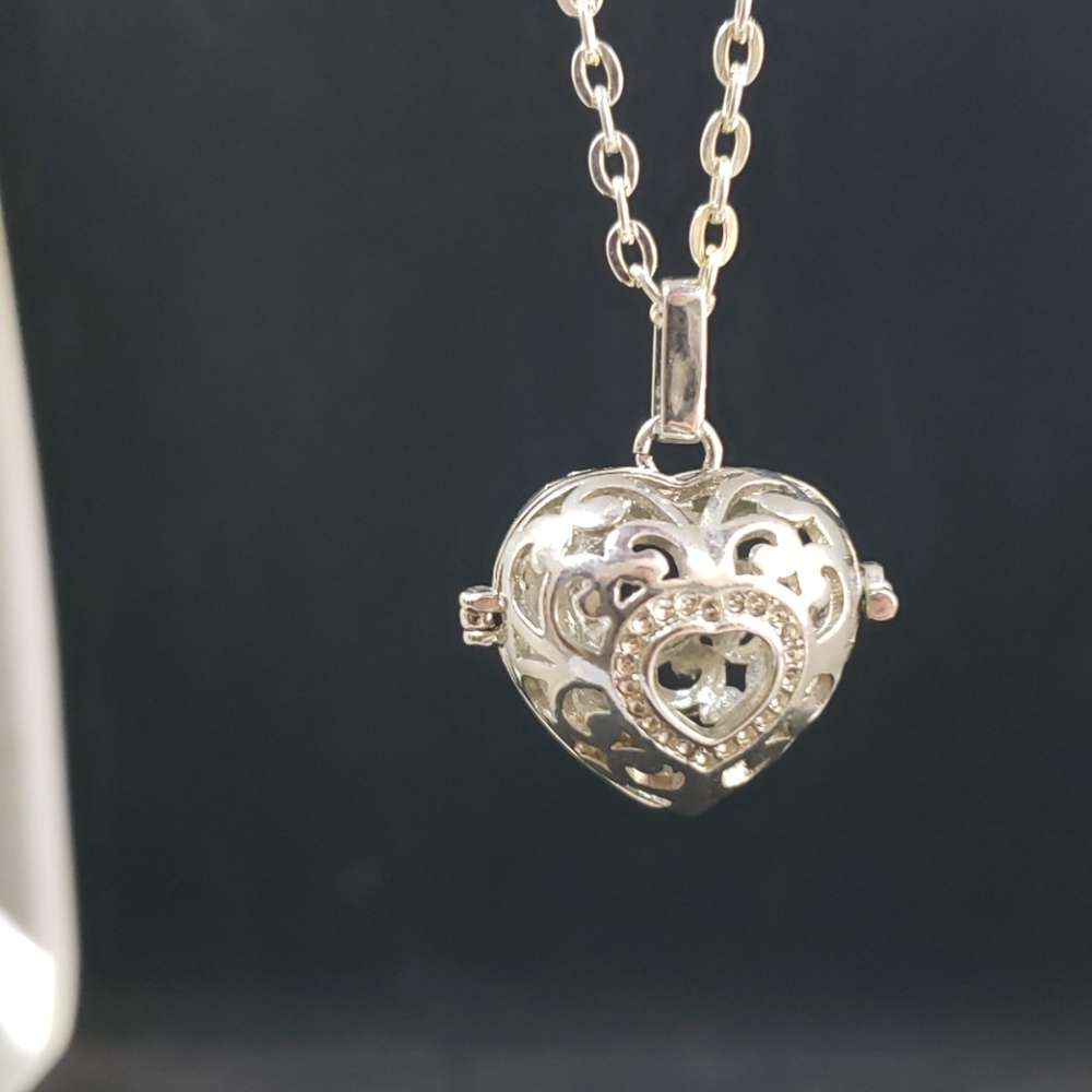 Heart shape silver tone cage pendant
